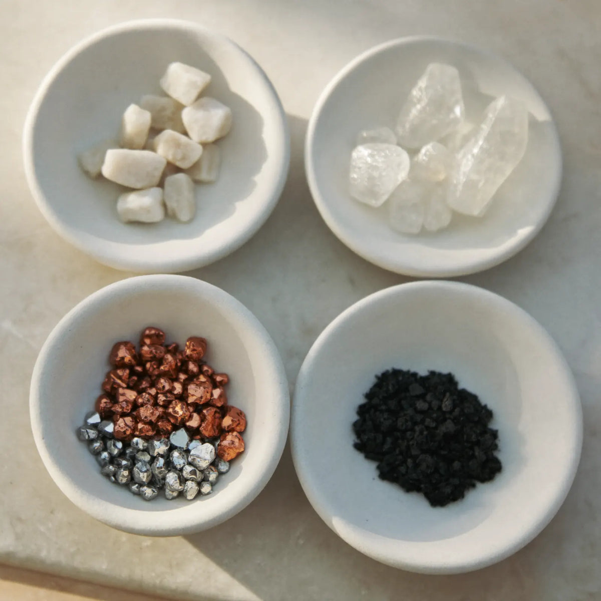 Illustration of four filter media labelled calcium sulfite, vitamin C, KDF and carbon (studio visualisation)